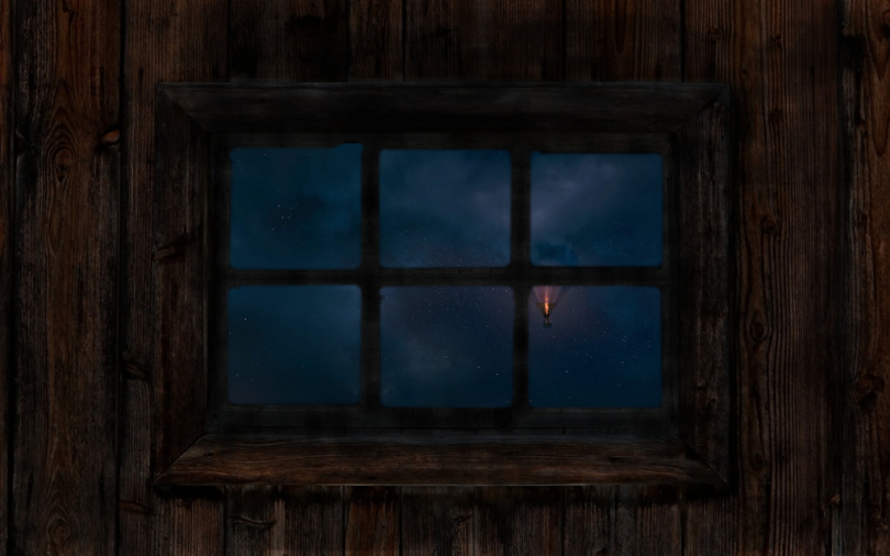 夜间在棕色木墙上的矩形6窗格窗